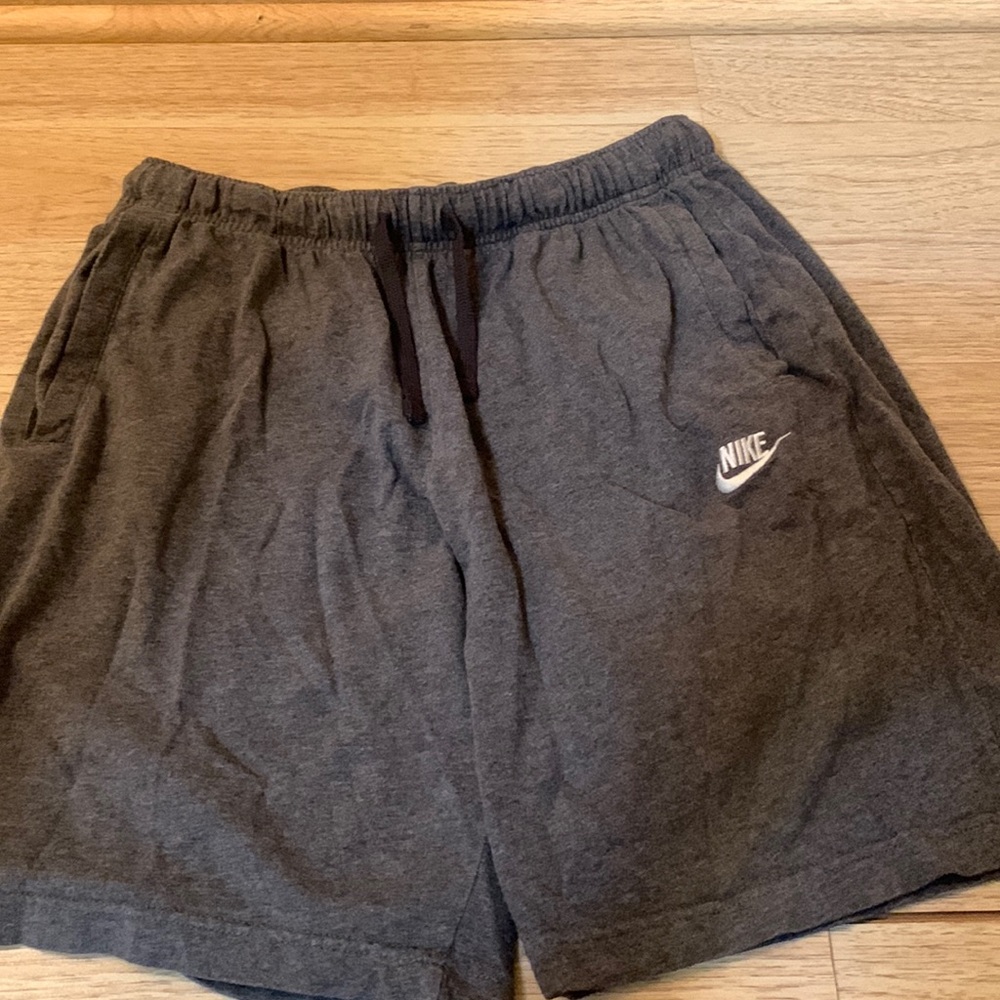 Mens Nike shorts. Dark Gray in color with pockets and drawstring.